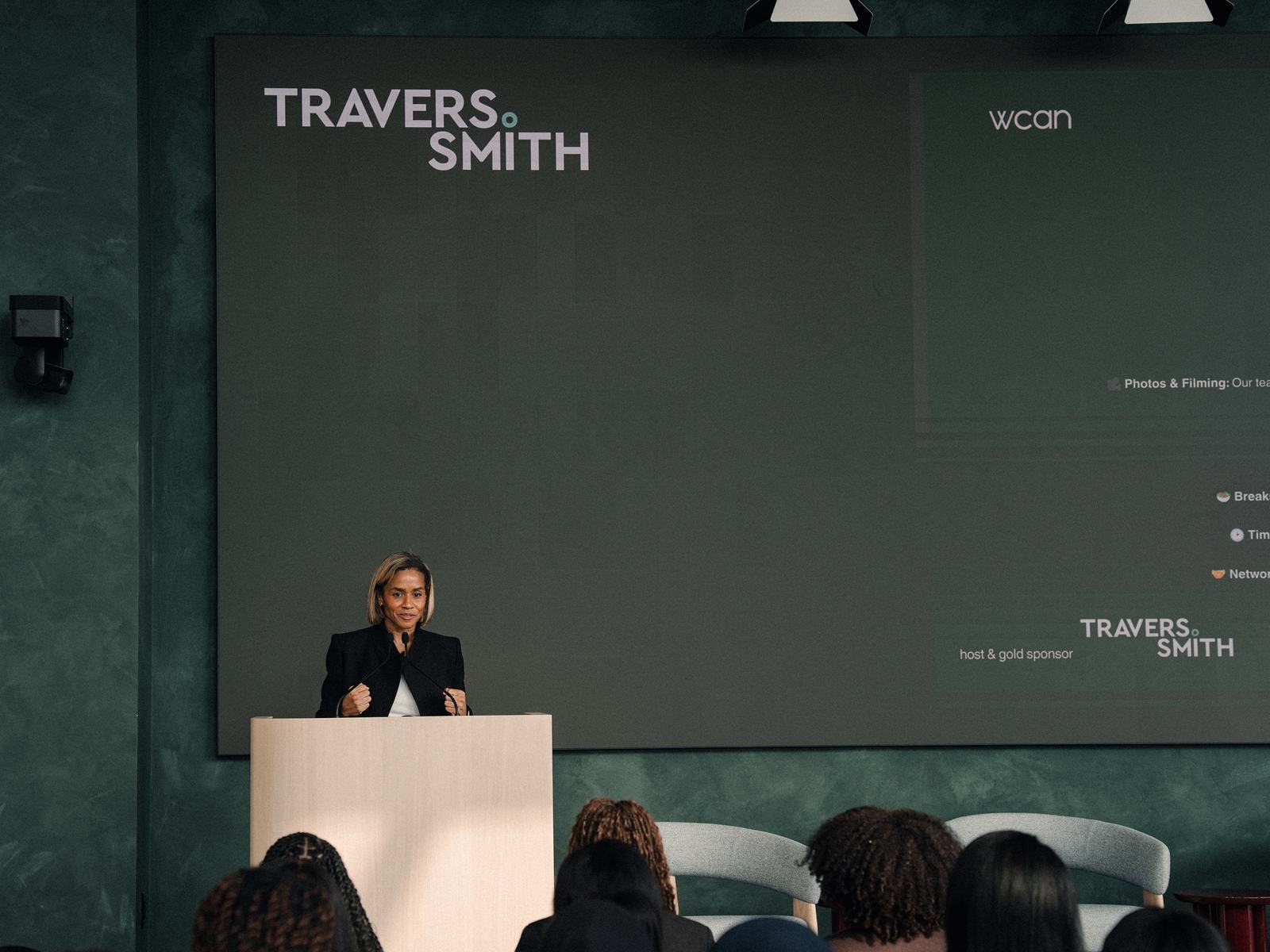 The stage at Travers Smith with WCAN branding