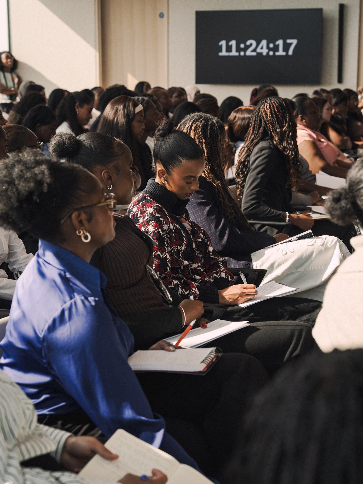 The audience taking notes